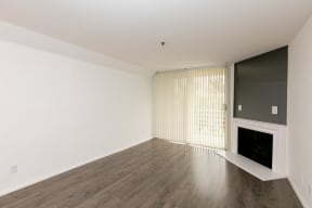 Living Room with Fireplace, Patio Doors and Hardwood Floors