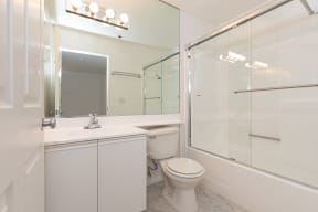 Bathroom with White Cabinets and Bathrub/Shower