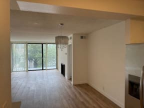 Living Room with Hardwood Floors, Fireplace and Patio Door