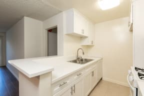 Kitchen with White Appliances and White Cabinets