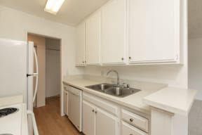Kitchen with White Appliances and White Cabinets