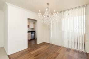 Dining Room with Hardwood Floors and Chandelier