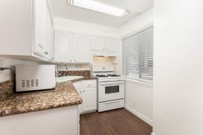Kitchen with White Appliances and White Cabinets