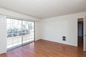Living Room with Hardwood Floors and Patio Doors