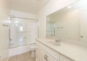 Bathroom with White Cabinets and Bathtub/Shower