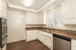 Kitchen with Stainless Steel Appliances and White Cabinets