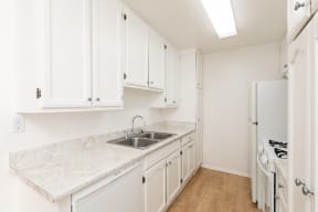Kitchen with White Appliances and White Cabinets