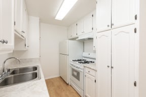 Kitchen with White Appliances and White Cabinets
