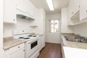 Kitchen with White Appliances and White Cabinets