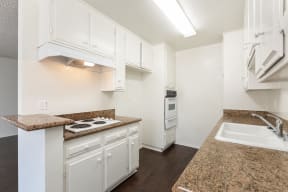 Kitchen with White Appliances and White Cabinets