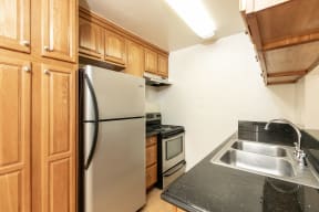 Kitchen with Stainless Steel Appliances and Wood Cabinets