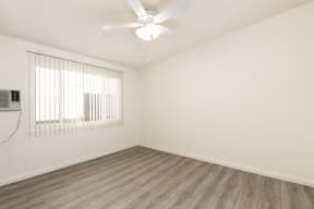 Bedroom with Hardwood Floors and Fan