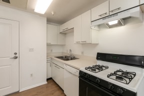 Kitchen with White Cabinets and Hardwood Floors
