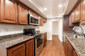 Kitchen with Stainless Steel Appliances and Wood Cabinets