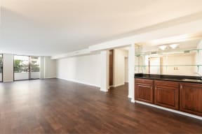 Living Room with Hardwood Floors, Patio Doors and Wet Bar