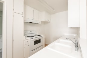 Kitchen with White Appliances and White Cabinets