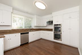 Kitchen with Stainless Steel Appliances and White Cabinets
