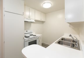 Kitchen with White Appliances and White Cabinets