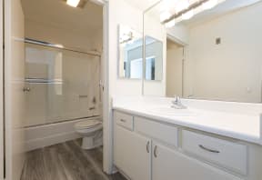 Bathroom with White Cabinets and Bathtub/Shower