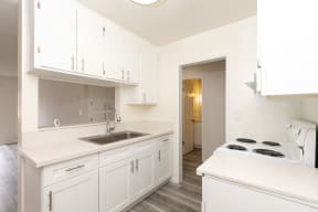 Kitchen with White Appliances and White Cabinets