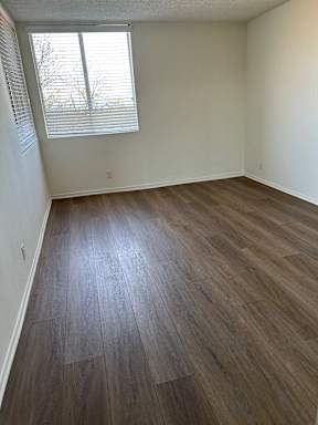 Bedroom with wooden flooring