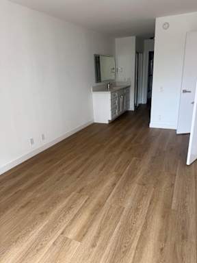 Bedroom with wood flooring