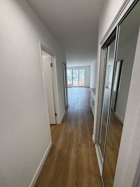 Bedroom with wood flooring
