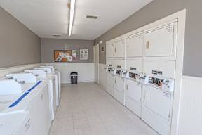 Onsite laundry room with washers and dryers at Laurel Parc apartments in Shreveport, LA.