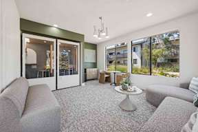 A "work from home" room with grey couches and sound-proof study pods.