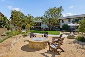 Outdoor seating around a fire pit.