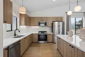 A modern clubhouse kitchen with large island.