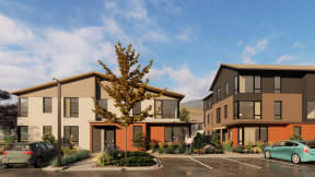a rendering of two story townhomes with a tree in the middle of a parking lot at Lido Apartment Homes @ Hailey, ID, Hailey, ID 83333