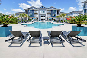 Pool with sun loungers at HAVEN POINTE AT CAROLINA FOREST APARTMENTS, Myrtle Beach, SC, 29579