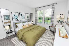 Bedroom with Large Bed at POINTE AT EAST SHORE APARTMENTS, APOPKA