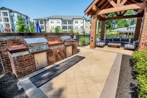 the reserve at bucklin hill leasing office patio with grill and seating area