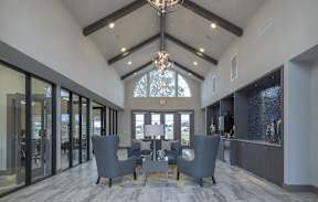 Large room with chandelier at One White Oak Apartments, Cumming