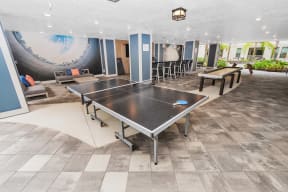 a large room with a ping pong table