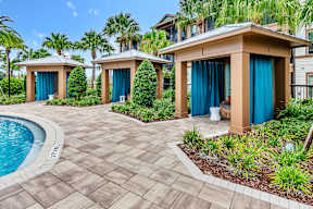 Poolside cabanas at POINTE AT EAST SHORE APARTMENTS, APOPKA, FL