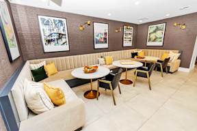Seating area with tables and chairs at POINTE AT EAST SHORE APARTMENTS, APOPKA, FL, 32703