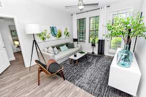 Living area with couch at POINTE AT EAST SHORE APARTMENTS, APOPKA, 32703