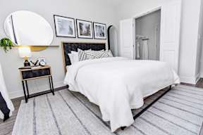 Cozy Bedroom with Nightstand at POINTE AT EAST SHORE APARTMENTS, APOPKA, FL, 32703