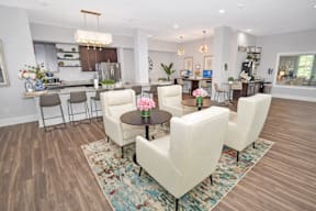 Furnished Living Room with white chairs at HAVEN POINTE AT CAROLINA FOREST APARTMENTS, Myrtle Beach, SC, 29579