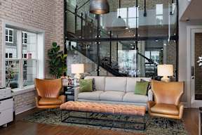 a living room with a couch and two chairs