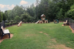a backyard with a play yard and a playground