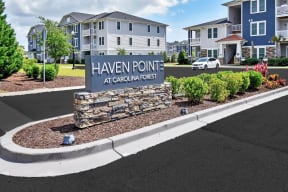 a sign that says haven pointe in front of a building
