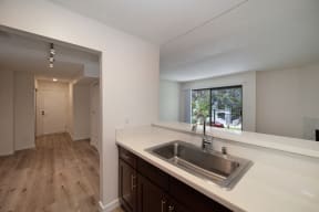 a kitchen with a sink and a window at Croft Plaza Apartments, California, 90069