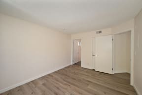 Apartment home bedroom with closet at Croft Plaza Apartments, California