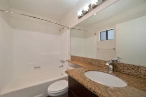 a bathroom with a bathtub and a sink at Croft Plaza Apartments, West Hollywood