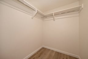 a small room with white walls and a wooden floor at Croft Plaza Apartments, West Hollywood, CA