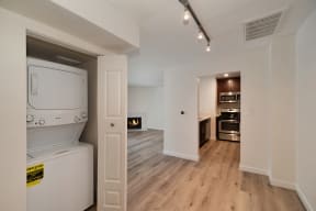 a spacious laundry room with a washer and dryer at Croft Plaza Apartments, California, 90069